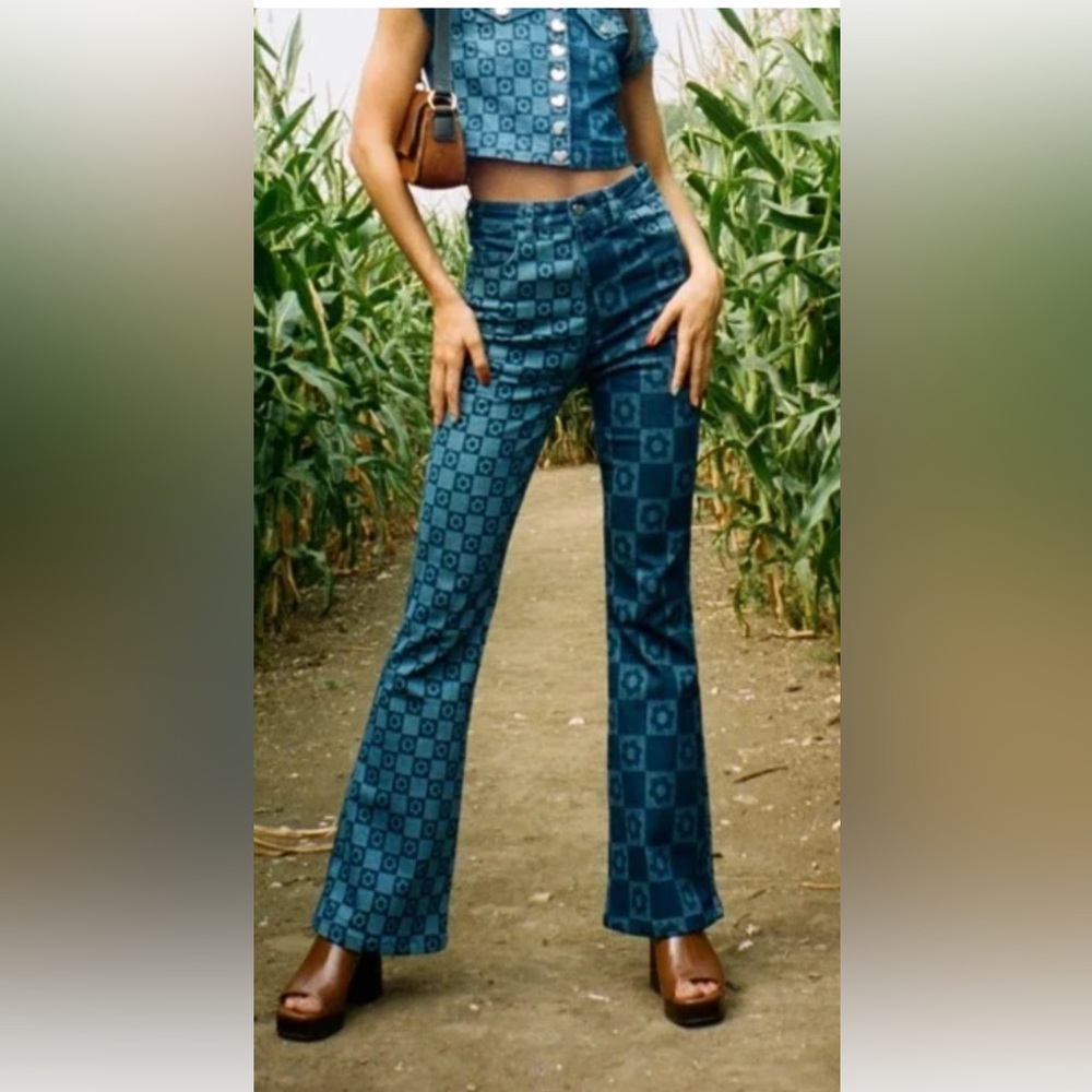 Blue flare jeans with flower detail